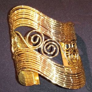 Cuff Bracelet Gold Tone in color